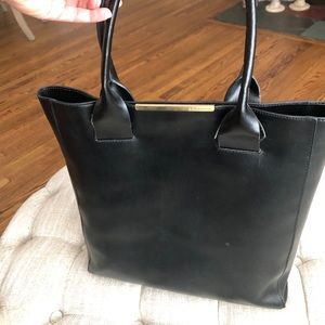 BCBG black computer bag with gold accent
